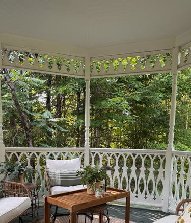 a porch with wicker furniture and wicker furniture