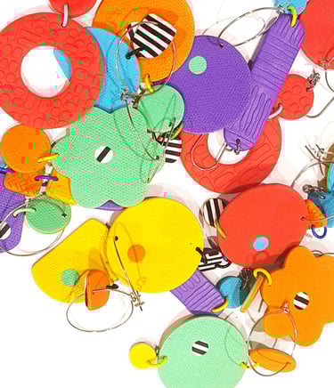 bright coloured earrings in a pile