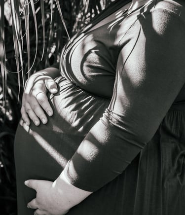 a pregnant woman in a dress with a baby in her belly