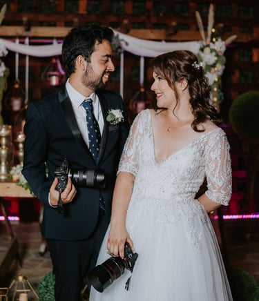 a man and woman standing in front of a wedding ceremony