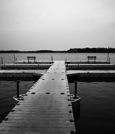 a dock with benches and benches in the water