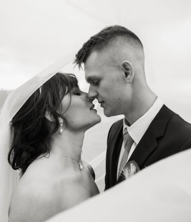black and white bride and groom portrait, under the veil shot