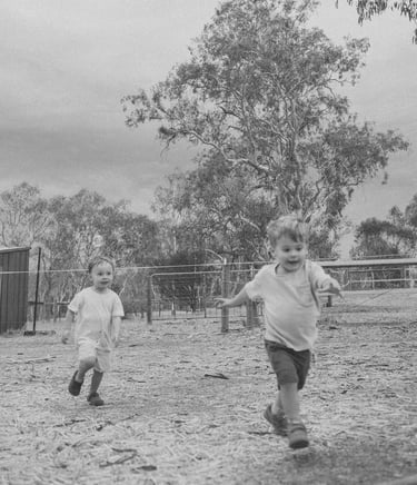 toddler friends running towards the camera in Adelaide Hills 