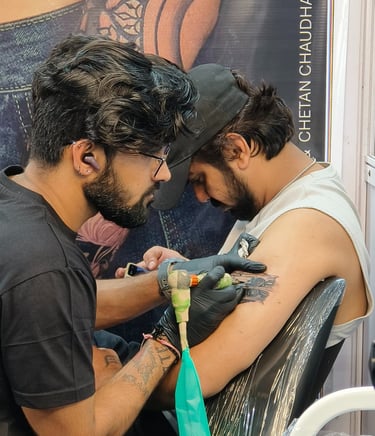 a man getting a tattoo on his arm