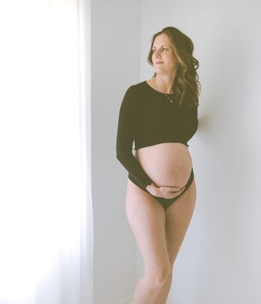 maternity photo taken in Adelaide studio, mother looking out the window