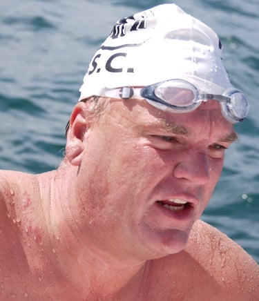 Graeme Lowe in swimming cap and goggles