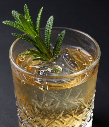 An exquisite close-up photograph of custom cocktail ingredients, fresh herbs, golden liquid droplets on crystal glass, dark charcoal black background, highly luxurious and artistic editorial presentation.