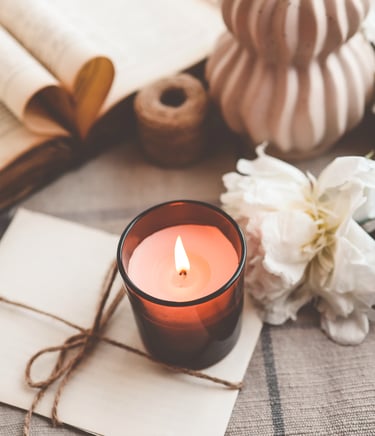 Amber jar candle within a whimsical setting
