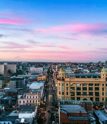 A drone image looking south down Chapel Street Precinct at sunrise