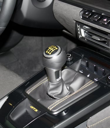 gear lever of a Porsche 911 accented in yellow