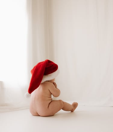 baby with a christmas hat on taken as a milestone session in studio, Adelaide Hills