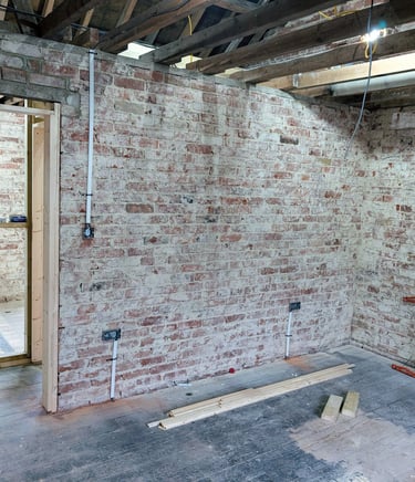 Exposed walls of a renovation and rewire at 1st fix stage. completed by RAD Energise