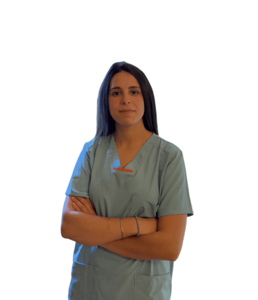 a woman in scrubs and scrubs standing in front of a white wall