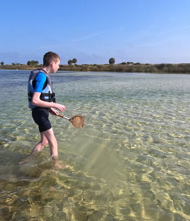 a man in a life jacket is holding a paddle paddle and paddle paddle