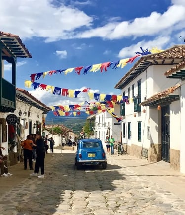 Vibrant view of crowded historic colonial streets with visitors during a private Villa de Leyva tour