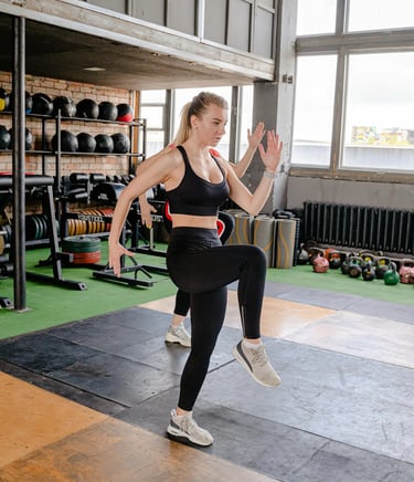 Woman performing a dynamic lunge exercise, demonstrating an active and healthy lifestyle.
