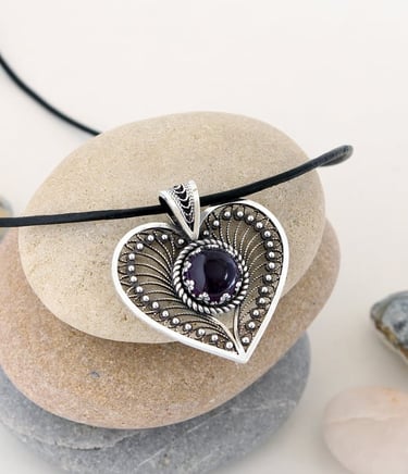Handmade silver filigree heart pendant with a natural Amethyst gemstone