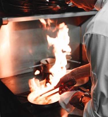An image of a chef cooking to indicate the higher turnaround and increased food and beverage sales