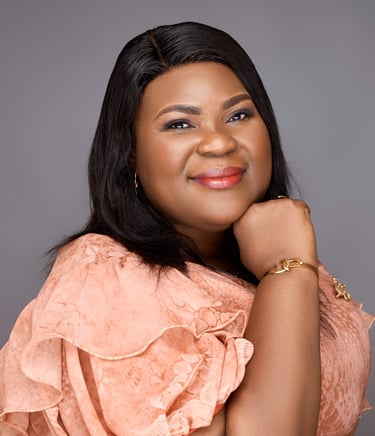 a woman in a pink dress and gold jewelry