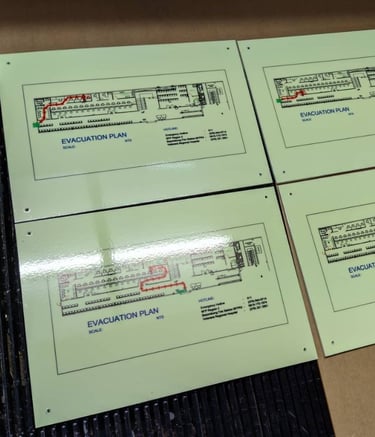 Green acrylic Evacuation Plan 4 piece showing floor plans