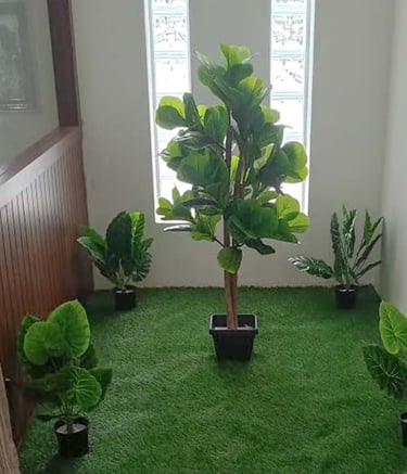 Low-maintenance artificial plants styled to look natural by Garden Designers