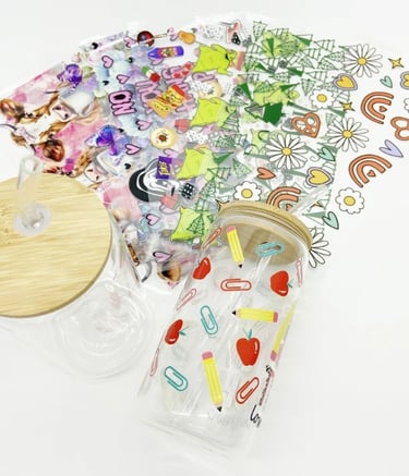 bunch of DTV UV stickers and 2 Soda jar with 1 full decorated stickers