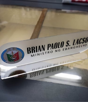 Frosted acrylic desk nameplate with church emblem.