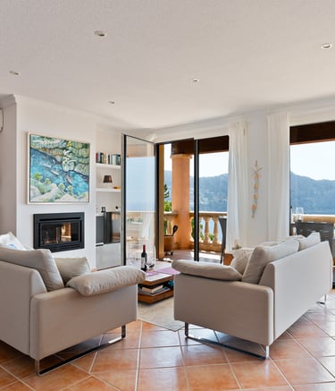 a living room with a fireplace and a fireplace