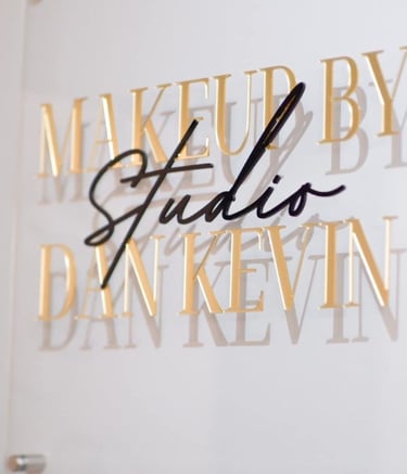 Acrylic Wall Frame with Gold and black text that say Makeup by studio Dan Kevin