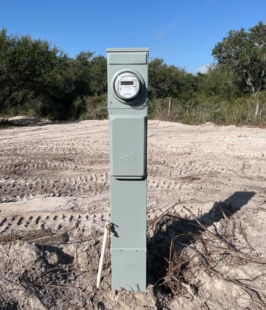 a cleared lot of land with an RV meter installed