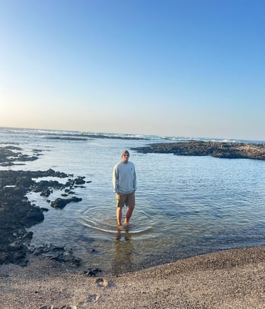 Seamusthefreenomad standing in the sea at the beach