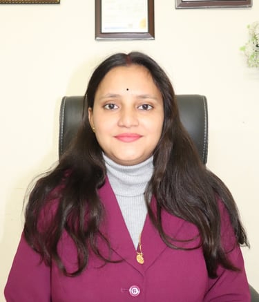 a woman in a purple jacket and a white shirt