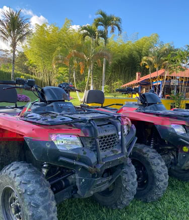 a couple of atvs parked in the grass