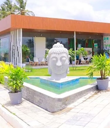 Artistic fibre statue centerpiece in a landscaped garden by Garden Designers