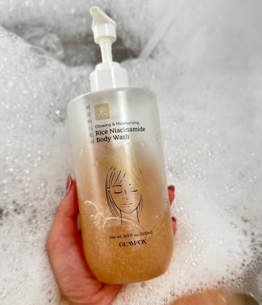 a person holding a bottle of liquid soap UGC