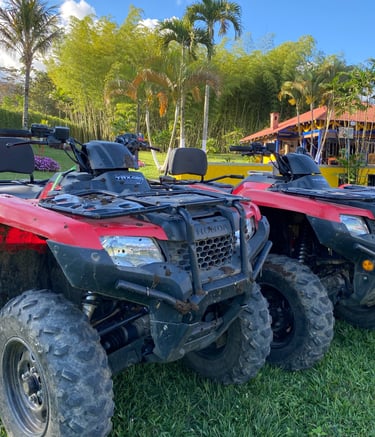 a couple of atvs parked in the grass