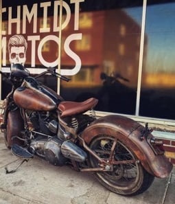 Vintage looking motorcycle in front of window