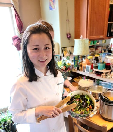 Chef Mia holding fresh spring salad with roasted mushroom. Gluten-free chef, private chef Portland.