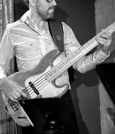 Black and white photo of Hank playing bass