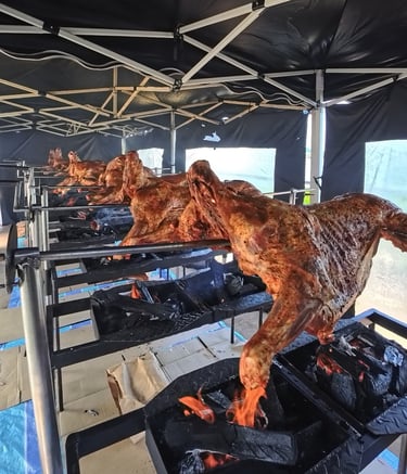 a bunch of meat on a grill with meat on it