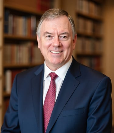 a man in a suit and tie smiling