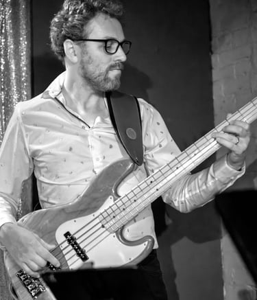 Black and white photo of Hank playing bass