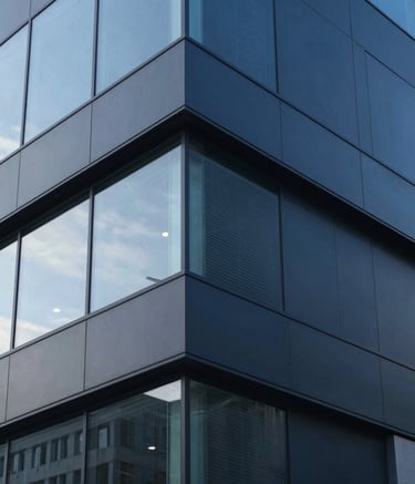 A detailed macro shot of modern industrial building materials, featuring glass and dark blue aluminum cladding. Sharp focus, clean textures, professional architectural style, North American urban setting.
