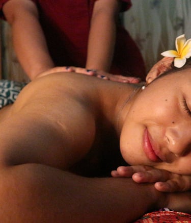 a woman getting a massage at a spa