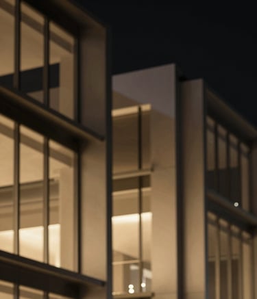 An abstract, high-end architectural shot showing sleek, precision-engineered metal structures and glass, reflecting warm gold light against a deep black night sky, symbolizing the 'Systems' built by the agency. Minimalist and ultra-professional style.