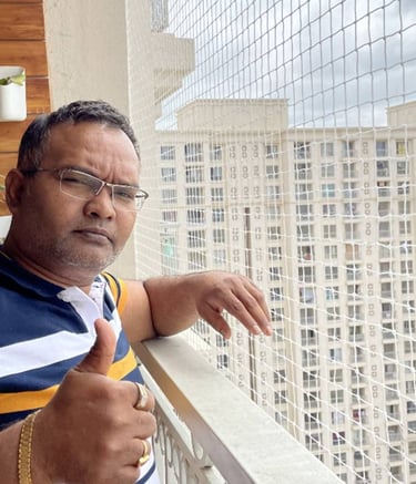 Installation team fitting pigeon nets on sarja windows in Bangalore