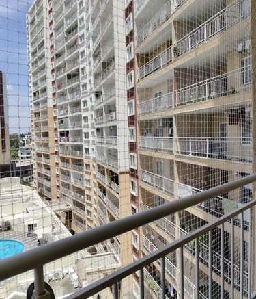 Installed pigeon net blending seamlessly with balcony railings