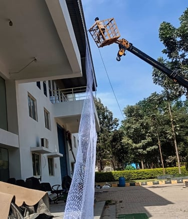 Close-up of tightly woven pigeon netting protecting warehouse vents