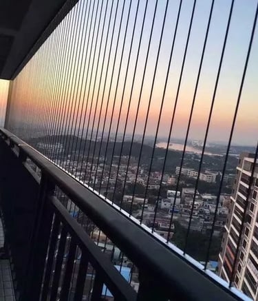Finished invisible grill installation blending into the architecture of a Besant Nagar home.