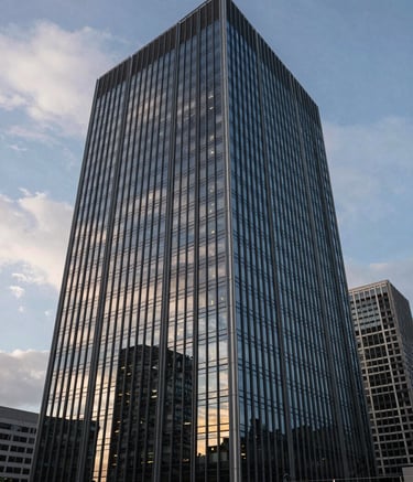 A wide-angle shot of a modern glass high-rise headquarters in a International / Global financial district during twilight, with deep navy and soft cloud white lighting reflecting on the sleek exterior.